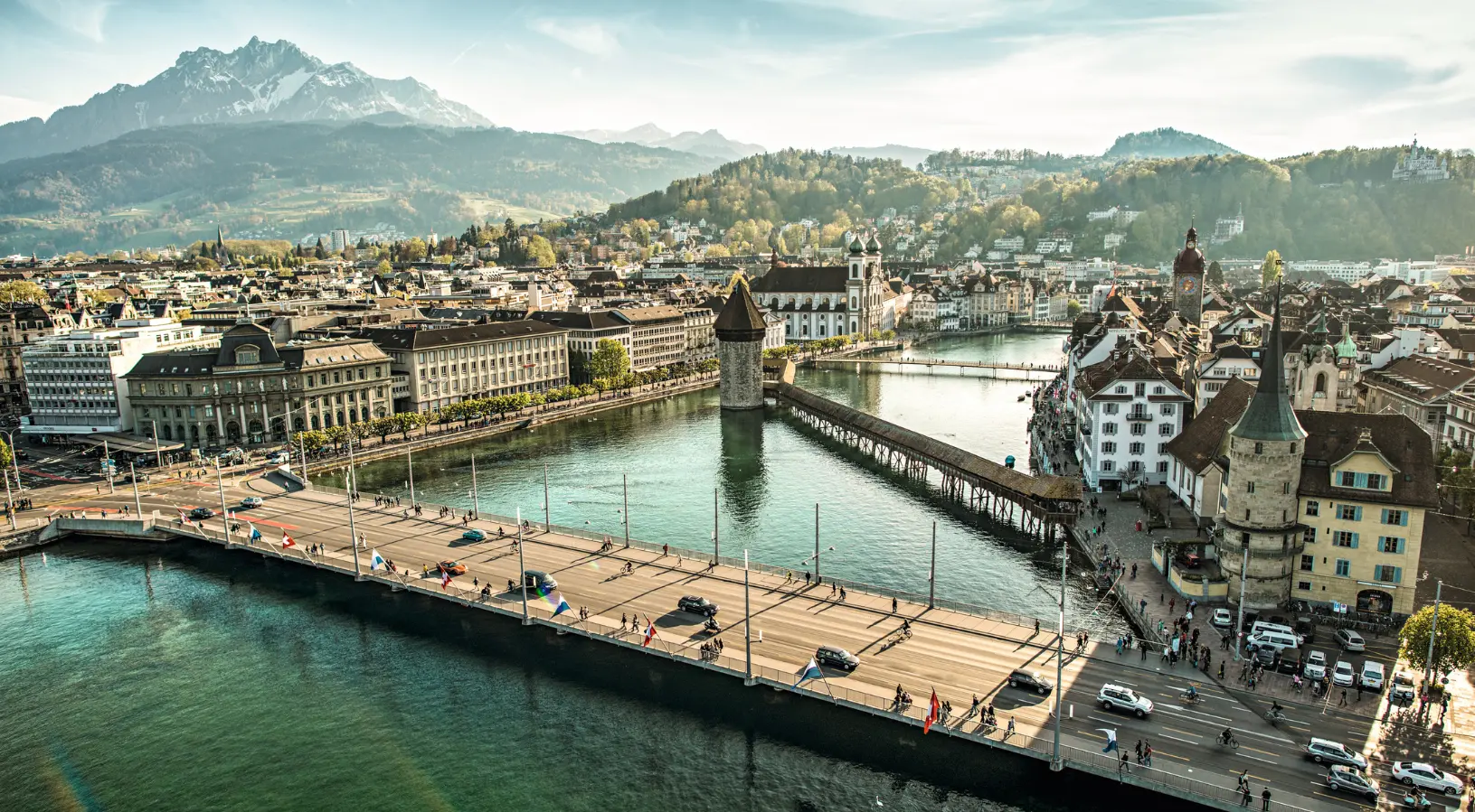 Sunset glow over Chapel Bridge and Reuss River, capturing the romantic charm of the hidden gems in Lucerne.