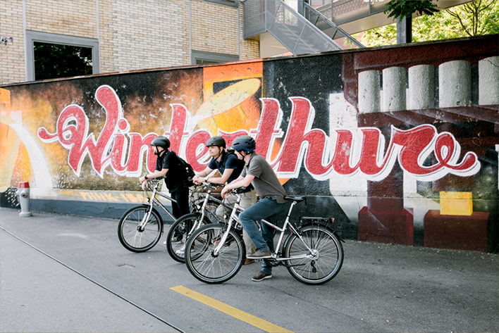 Switzerland tourists cycling